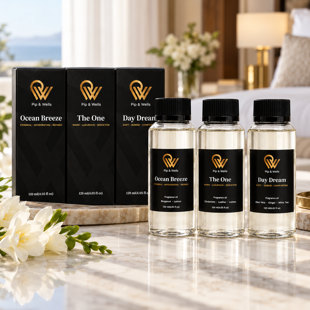 Pip & Wells Hotel Fragrances Geschenkset mit Flaschen von Ocean Breeze, The One und Day Dream neben ihren schwarzen Boxen
